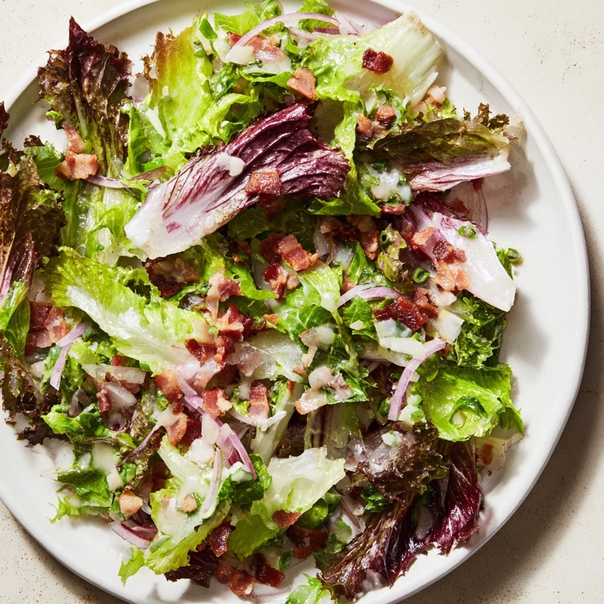 Delicious warm Bacon Dressing wilting the beautiful, healthy Bitter Greens Salad, a perfect American salad.