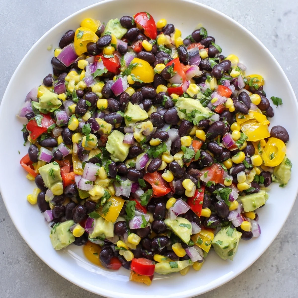 Vibrant Southwest Black Bean Salad with colorful bell peppers and a zesty lime dressing.