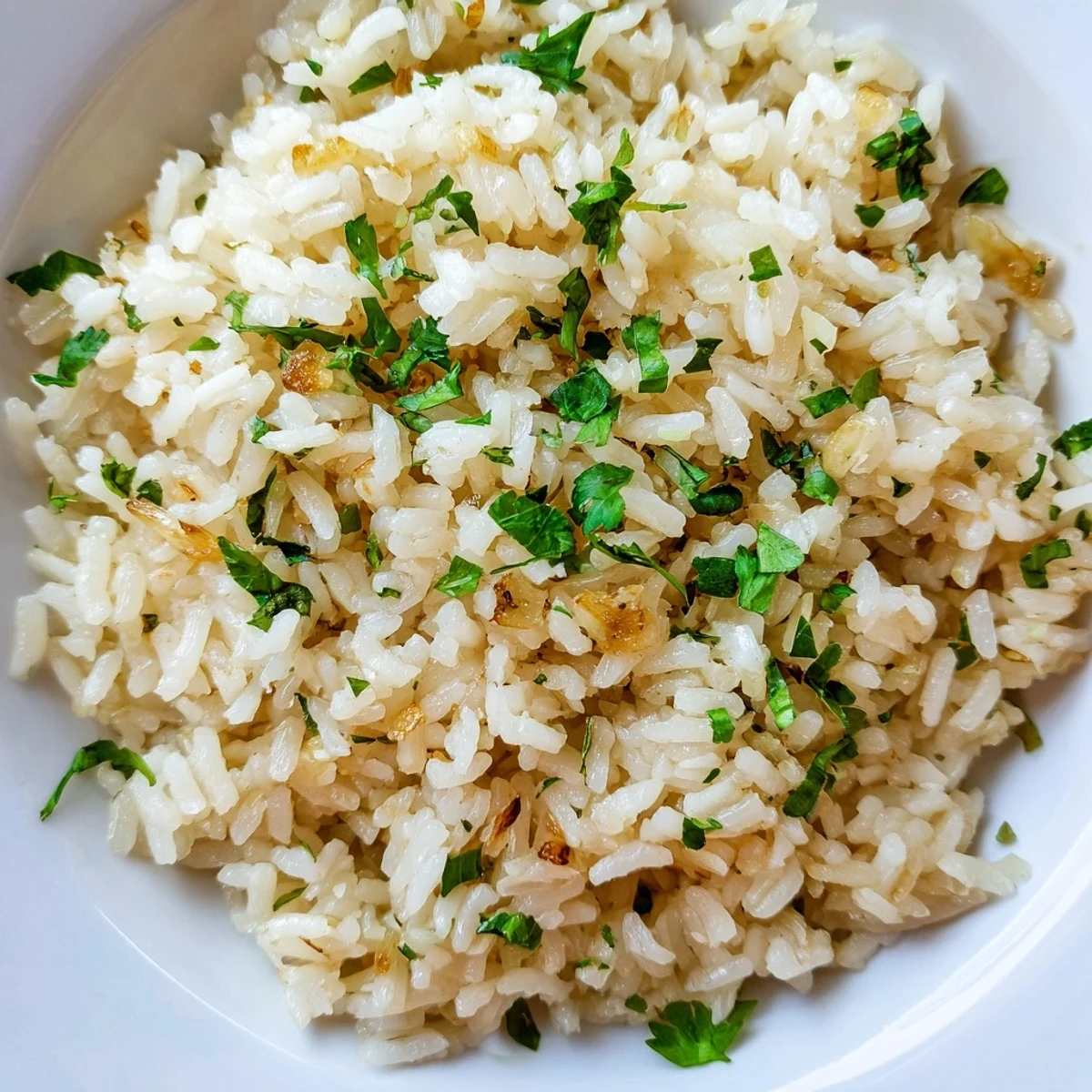 Golden garlic infuses tender jasmine rice grains in this easy, vegan Asian-inspired side dish.  
