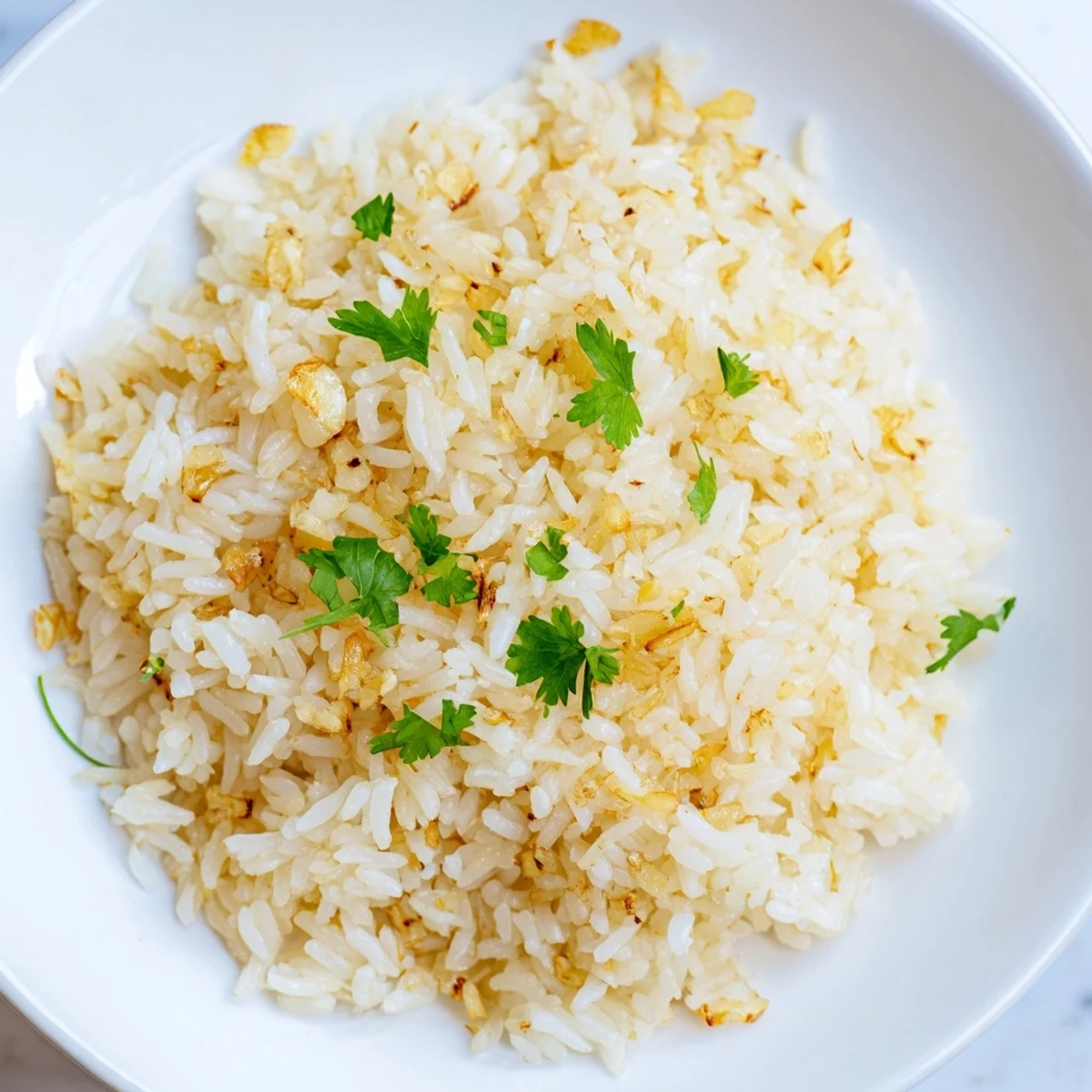 Steamed jasmine rice with minced garlic, fresh cilantro garnish, ready in 25 minutes.