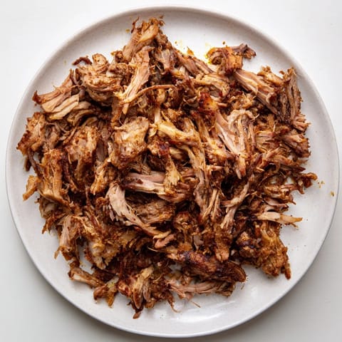 Meltingly soft Omani Shuwa meat, infused with spices, ideal alongside saffron rice and fresh salad.